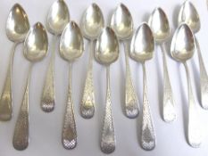 Twelve hallmarked solid silver grapefruit spoons having finely engraved handles, approx. 190 gms.