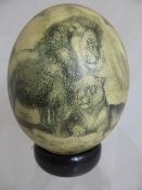 African Ostrich Egg finely decorated with lion, giraffe and springbok, gemsbok and zebra.