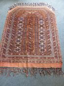 An Antique Middle Eastern Wool Rug, the rug with geometric design approx 106 x 136 cms.