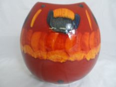 Poole Pottery The large `Volcanic` purse vase of red, orange, blue and charcoal colours. Impressed