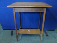 Oak occasional table on tapered legs united by a narrow under shelf, approx. 56 x 38 x 73 cms.