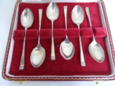 Six silver coffee spoons in a presentation box.