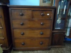 Victorian mahogany chest of drawers having two small and three graduated drawers with turned