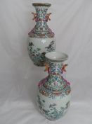 Pair of Chinese Famille Rose vases having foliate design, Qianlong marks to base, approx. 36 cms.