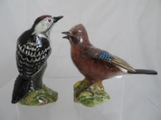 Two large Beswick figures of Garden Birds including Woodpecker and a Jay. (2)