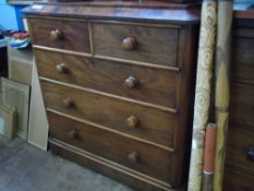 Victorian mahogany chest of drawers having a shaped top, two short and three graduated drawers