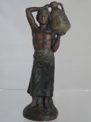 Victorian hand coloured plaster figure of a water carrier impressed 9985 to base. 20 cm`s height.