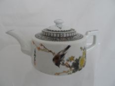 Chinese 20th century miniature porcelain teapot depicting a bird among blossoms, approx. 8 cms