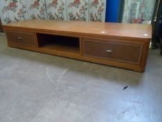 Contemporary Teak TV Stand two leather fronted drawer’s features storage space to centre. 180 x 56 x