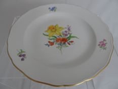 Meissen cabinet plate depicting hand painted daffodils, the plate having gilded rim and impressed