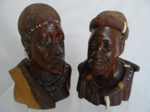 Two African rosewood carvings of a man and a woman having beaded jewellery and ivory work approx. 16