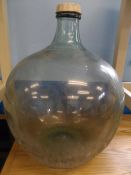 A large green glass carboy, approx. 64 cms.