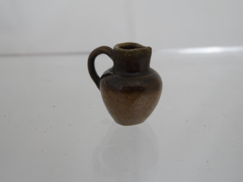 Stoneware Jug being 19th century and formed in miniature, approx. 20 mm. high