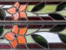 Six stained glass panels, foliate design, approx. 70 x 16 cms.