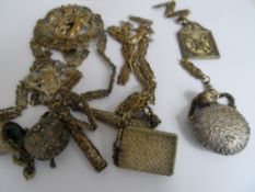Mid Victorian chatelaine with central oval decorated with cherubs and a mermaid, with second