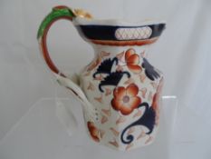 A Victorian jug, Masons style having a lion handle