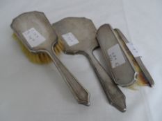 A gent`s solid silver vanity set comprising hair brush, clothes brush, hand mirror and comb,