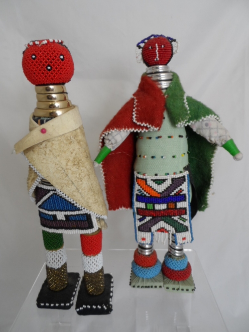 Beaded figures of a Zulu man and woman in tribal regalia, approx. 38 cms tall