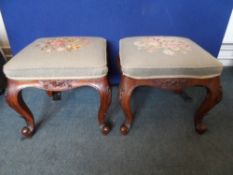 Two tapestry covered foot stools on cabriole legs with carved decoration (2)