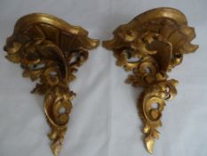 Pair of Continental wall sconces of gilded wood.