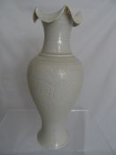Chinese ivory porcelain vase with scalloped lip and floral design, approx. 29 cms. high.