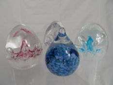 Caithness Paperweights collection of four including three Moonbeam and one Raindrop 2002.