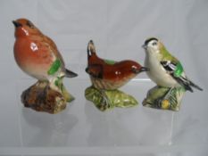 Three Beswick Garden Bird figures including Goldcrest, Robin, Wren.
