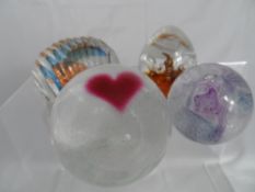 Caithness Paperweights a collection of four including Sea Pearl, Sweetheart, Moonbeam and Summer