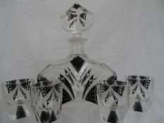 A cut glass decanter being of art deco style together with four " shot glasses " possibly Russian (