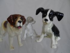 Three Sylvac Bunnies together with three little figures of dogs, St Bernard, Grey and White Dog