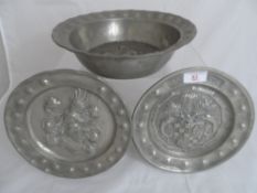 Miscellaneous antique pewter including a pie dish having raised heraldic crest to base with raised