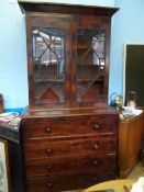 Victorian flame mahogany secretaire bookcase, glazed doors to the top enclosing three shelves, the