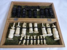 Ivory stained Chess set, Red and Black figures in original box which unfolds into a chess board.