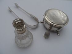 A collection of miscellaneous silver including; a pair of solid silver sugar tongs, London hallmark,