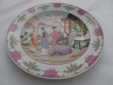 Late 19th century Famile Rose cabinet plate, the plate depicting characters to central cartouche, 23