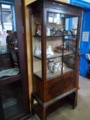 A Glazed Mahogany Display Cabinet. The cabinet being on a Chippendale style base, the base having an