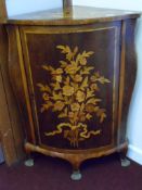 A Circa 18th Century Dutch Corner Cabinet; the cabinet being floor standing with inlaid floral