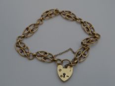 9ct gold hallmarked bracelet, The ladies bracelet having heart shaped clasp, 10 grams.