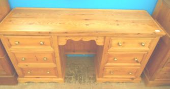 Pine Dressing Table, having three drawers to either side. 150 x 45 x 76 cms.