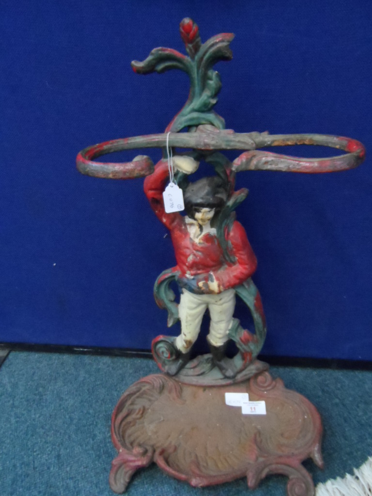 A Cast Iron Umbrella Stand; the stand being in the form of a gentleman in riding clothes.