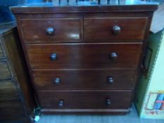 A Victorian Mahogany Chest of Drawers having two short and three long drawers on a plinth base,