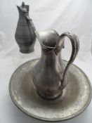 A gun metal jug and wash basin, manufactured and plated by Reed and Barton together with one other