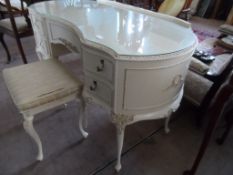 A Lady`s White French Style Dressing Table; the table having a triple folding mirror together with a