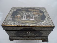 A Vanity Writing Box, the box being mother of pearl and lacquer, circa 1850, the box having