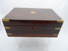 A Rosewood Writing Box, the box having brass corners with a flower shaped cartouche to the top. 35 x
