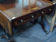 A Mahogany Inlaid Sofa Table; the table having banded inlay to top on twin column supports,