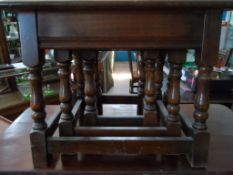 A Nest Of Tables, three tables being oak on turned legs with straight stretchers.