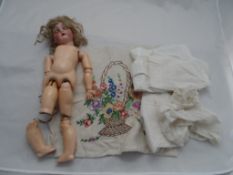 A circa 1910 Simon Halbig doll K * R, The bisque headed doll with brown sleeping eyes, open mouthed,