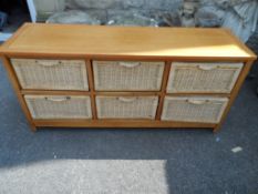 A Wooden Chest having six rattan drawers