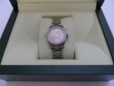 A Lady`s Stainless Steel Rolex Oyster Wristwatch; the watch complimented by a pink face with